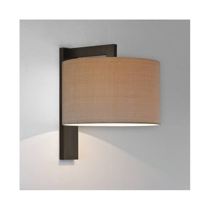 ASTRO RAVELLO WALL is a wall lamp with a cylinder-shaped lampshade