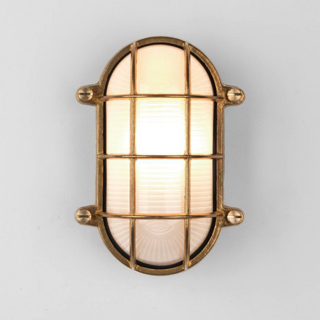 ASTRO THURSO Oval wall lamp with a protective grille in brass color