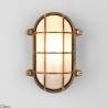 ASTRO THURSO Oval wall lamp with a protective grille in brass color