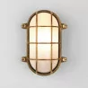 ASTRO THURSO Oval wall lamp with a protective grille in brass color