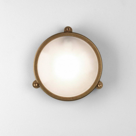 ASTRO MALIBU COASTAL is a round lamp in the color of antique brass