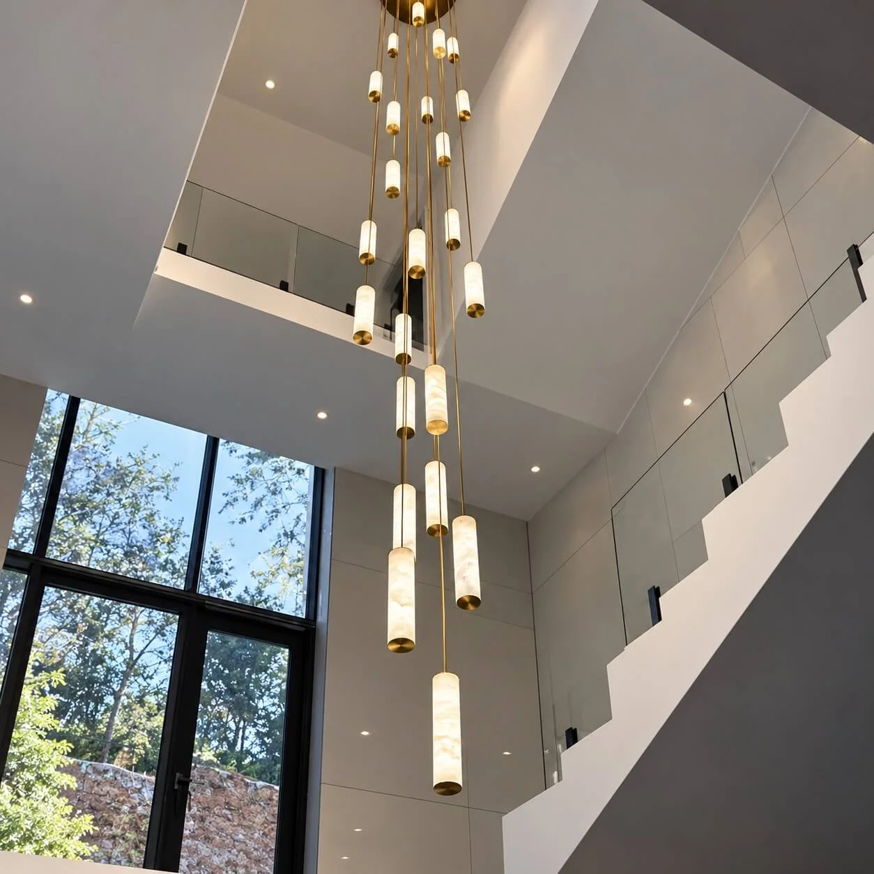 Large LED pendant light made of alabaster tubes.