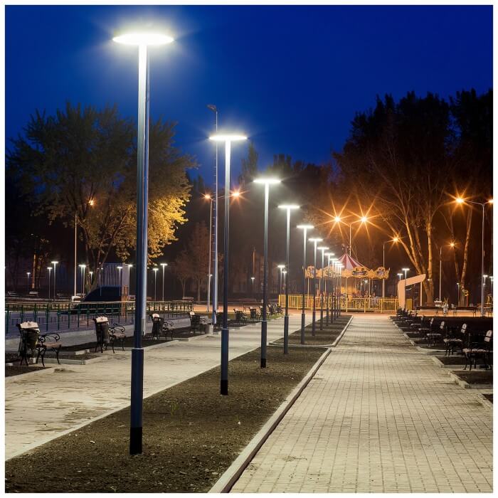 Modern solar LED street light installed along the sidewalk